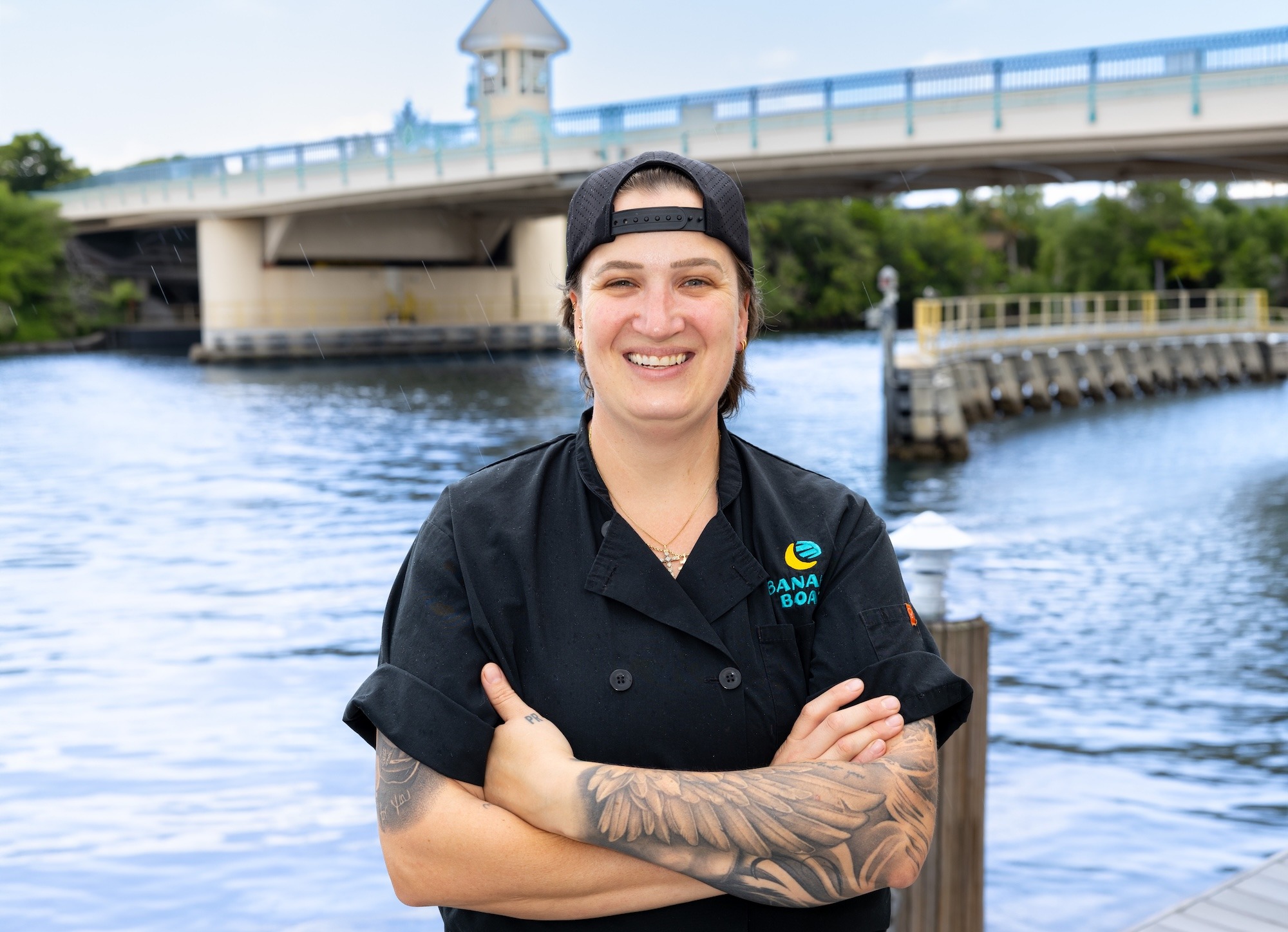 Headshot of the chef standing in front of a body of water