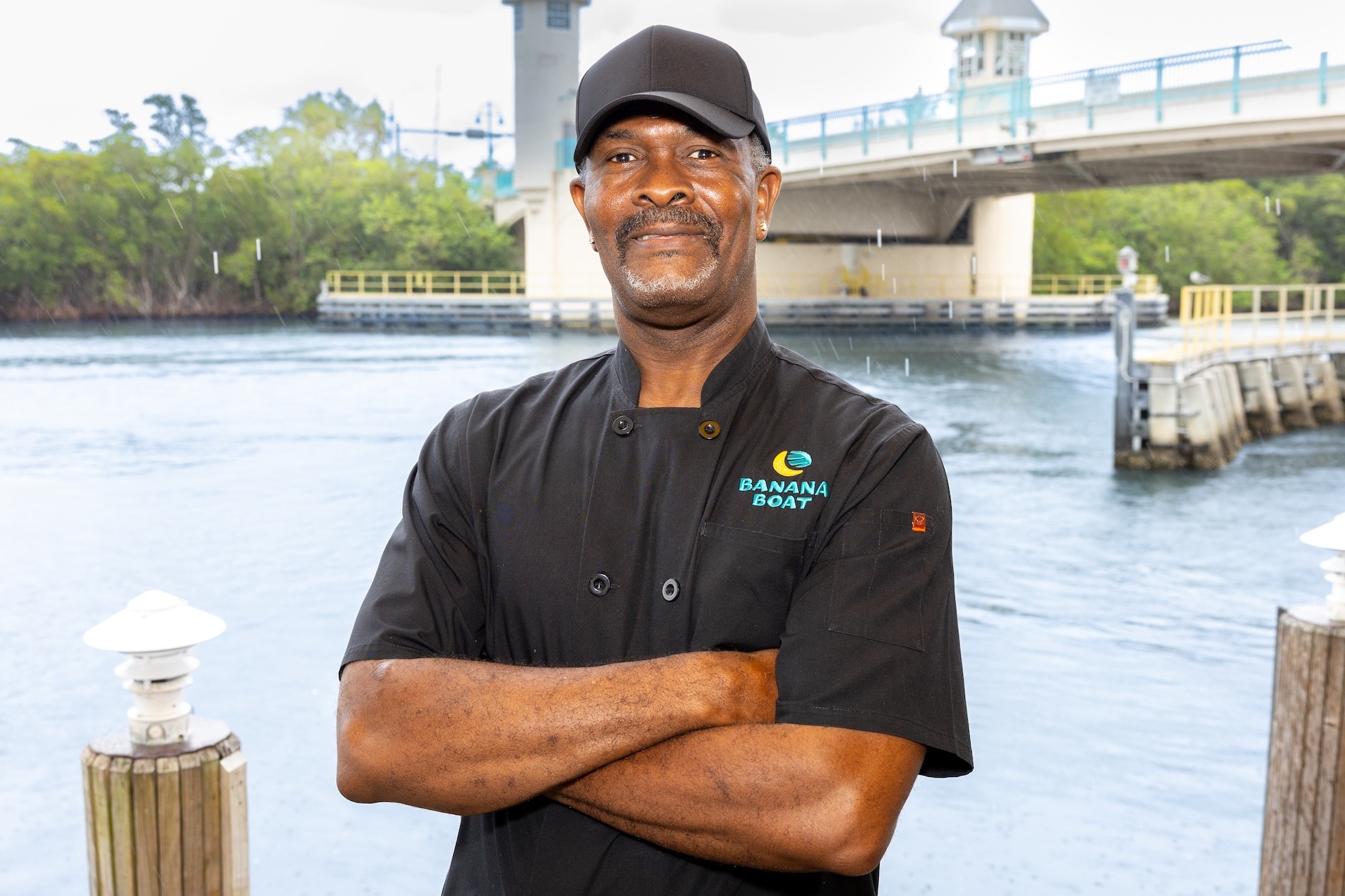 Headshot of the chef standing in front of a body of water